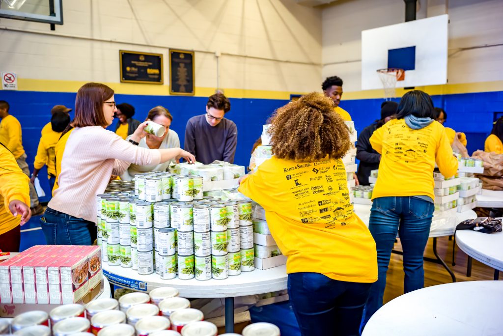 Tianna Kalogerakis assists with the Turkey Drive