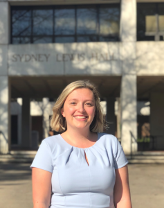 Photo of Melissa Lagoumis standing in front of building