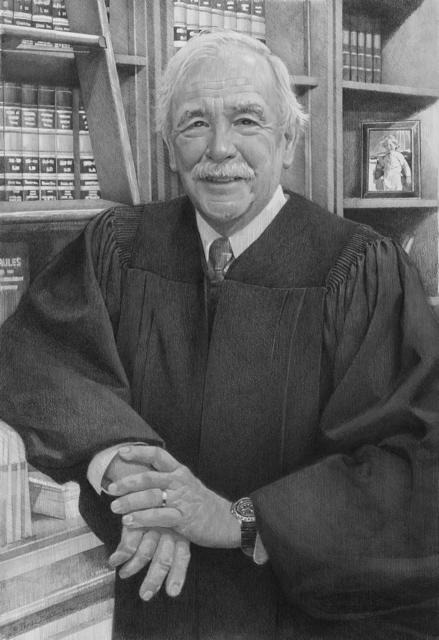 Headshot of Judge Herron in library